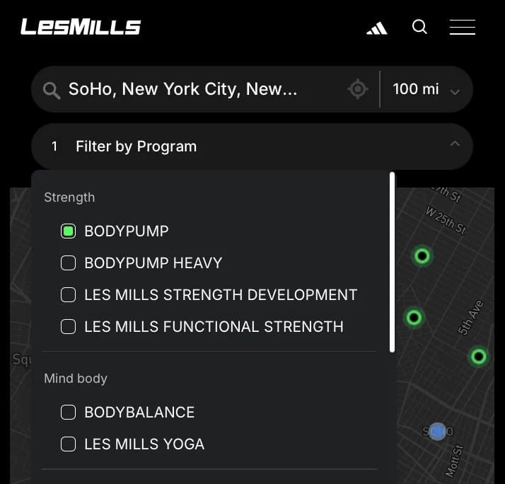 Les Mills locator with BODYPUMP selected in a program filter, classes grouped under Strength and Mind body, and green map markers.